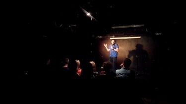 Comedian in a comedy club on stage